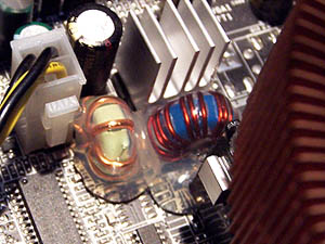 Photograph showing motherboard coils covered in glue